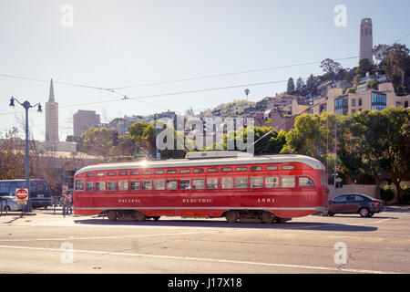 Historic streetcar (Pacific Electric No. 1061) near the Embarcadero in San Francisco, with the Transamerica Pyramid and Coit Tower in the background. Stock Photo