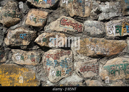 Writing carved on a stone wall Swayambhu / Swayambhunath, Kathmandu, Nepal Stock Photo