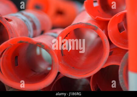 Red cylinder traffic cones stacked Stock Photo