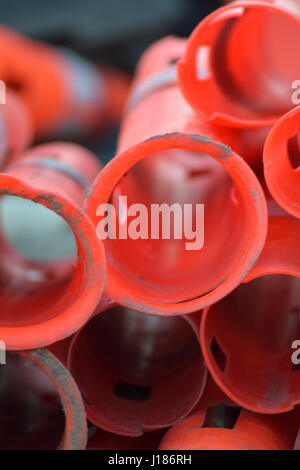 Red cylinder traffic cones stacked Stock Photo