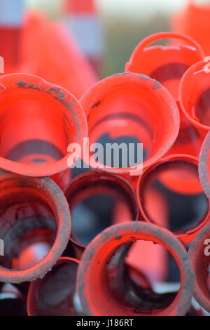 Red cylinder traffic cones stacked Stock Photo