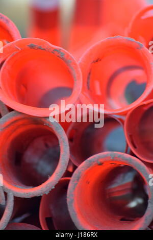 Red cylinder traffic cones stacked Stock Photo