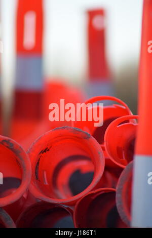 Red cylinder traffic cones stacked Stock Photo