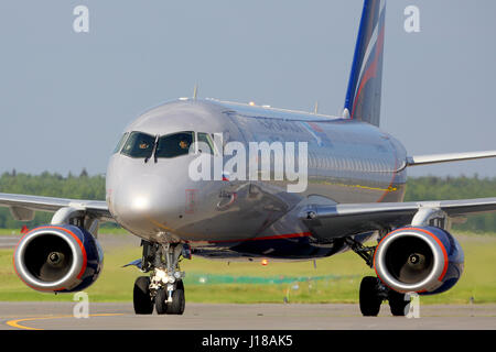 SHEREMETYEVO, MOSCOW REGION, RUSSIA - JULY 1, 2015: Aeroflot Sukhoi Superjet-100 RA-89024 landing at Sheremetyevo international airport. Stock Photo