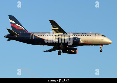 SHEREMETYEVO, MOSCOW REGION, RUSSIA - JULY 13, 2015: Aeroflot Sukhoi Superjet-100 RA-89045 landing at Sheremetyevo international airport. Stock Photo