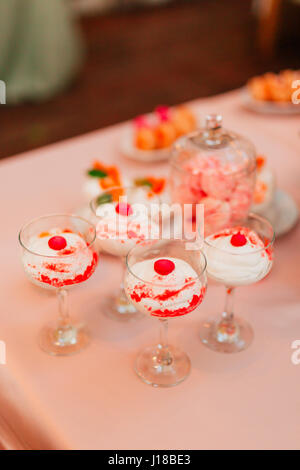 Vanilla pudding in a glass with a cherry Stock Photo