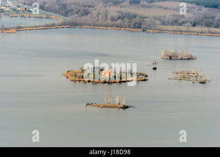 Kostel sv. Linharta church from 13th century in former village Musov - now on small island on the middle of  Vestonicka nadrz water reservoir from Dev Stock Photo