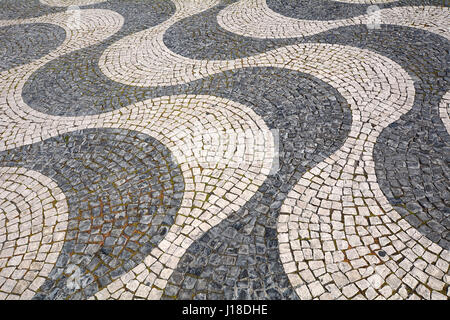 Detail of a typical portuguese cobblestone hand made pavement - Lisbon, Portugal Stock Photo