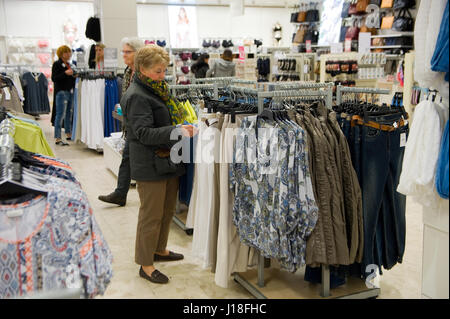 ENSCHEDE, THE NETHERLANDS - APRIL 13, 2017: Women are shopping in clothes store C&A after it has been reopened Stock Photo
