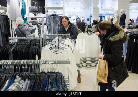 ENSCHEDE, THE NETHERLANDS - APRIL 13, 2017: Woman are shopping in clothes store C&A after it has been reopened. Stock Photo