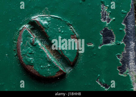 Background of a green painted rusty screw Stock Photo
