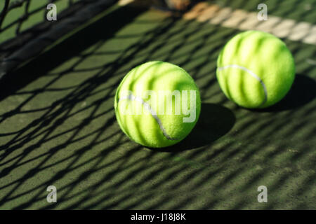 Two tennis balls in a court Stock Photo