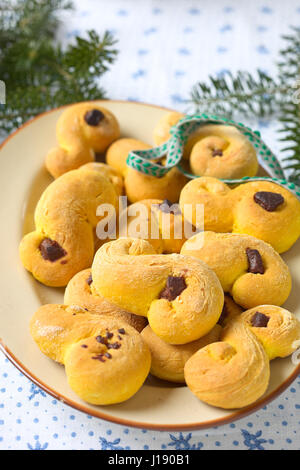 Sweet Swedish buns baked with saffron and chocolate.