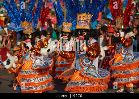 Morenada dance group in traditional Andean costume performing at the ...