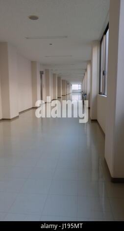 Deserted empty corridor or hallway in a clean and new building Stock Photo