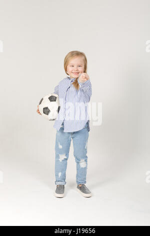 pretty little blonde girl with soccer ball Stock Photo