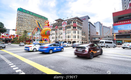 SINGAPORE - JANUARY 20: Chinatown street traffic in Chinatown district, Singapore. Chinese New Year celebrations in 2017. Stock Photo