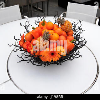Lifestyle display of fruit and flowers Stock Photo