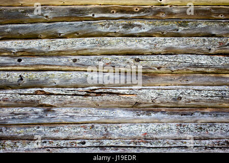 Wooden background of old logs worn by time Stock Photo
