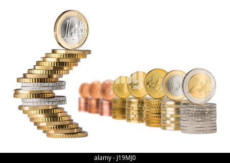 euro symbol shaped out of coins beside stack row of every euro cent coin isolated on white background Stock Photo