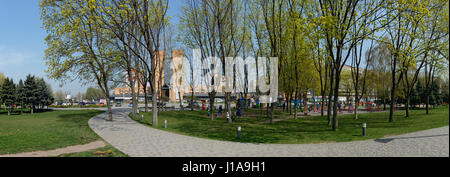 Bright sunlight of early spring is illuminating the New Park that is across shopping center Babylon on Dnieper riverbank in front of Sunny (Solnechny) Stock Photo