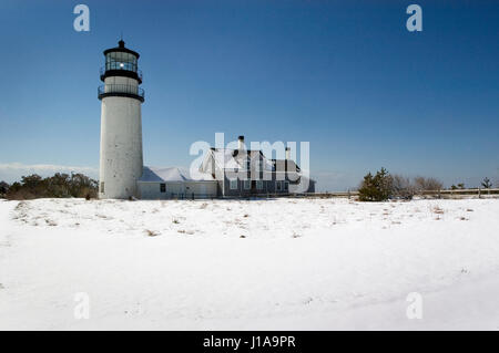 Cape Cod Light - Also know as Highland Light in Truro, Massachusetts - Cape Cod National Seashore following an early spring snowfall Stock Photo