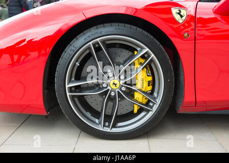 Alloy front wheel of Ferrari 488 Spider showing Brembo carbon ceramic brake discs and calipers Stock Photo
