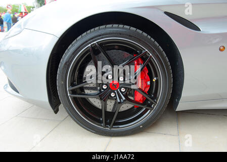 Ferrari California T front wheel showing Brembo carbon ceramic brake disc and caliper Stock Photo