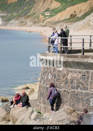 West Bay, Dorset, UK. 19th Apr, 2017. The sunny weather brings people out to enjoy the coastal seaside town and beach in west Dorset during the Easter holidays. Credit: Dan Tucker/Alamy Live News Stock Photo