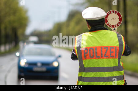 Munich, Germany. 19th Apr, 2017. A police officer pulls a car over at a speed checkpoint in Munich, Germany, 19 April 2017. Police in several german states are enforcing stricter speed controls as part of a continent-wide speed control marathon. Photo: Matthias Balk/dpa/Alamy Live News Stock Photo