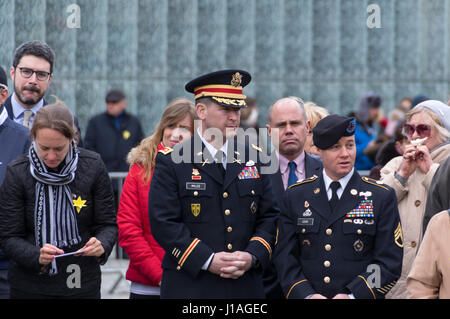 Warsaw, Poland. 19th April, 2017. Two American soldiers attend a ceremony in front of the Ghetto Heroes Monument to mark the 74th anniversary of the Warsaw Ghetto Uprising and pay tribute to the Jewish fighters, who rose up against German Nazi in April, 1943. Stock Photo