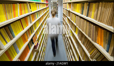 Ditzingen, Germany. 03rd Feb, 2017. A Reclam employee walks through the archives of the publishing house in Ditzingen, Germany, 03 February 2017. The company celebrates this year the 150th anniversary of its Universal-Bibliothek line of books, the oldest book series in the german book market. Photo: dpa/Franziska Kraufmann/dpa/Alamy Live News Stock Photo