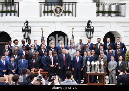 Washinton D.C., USA. 19th Apr, 2017. U.S. President Donald Trump(front C) poses for photos with New England Patriots at a ceremony welcoming the visit of the Super Bowl Champion New England Patriots on the South Lawn of the White House in Washington, DC, the United States, April 19, 2017. Credit: Yin Bogu/Xinhua/Alamy Live News Stock Photo