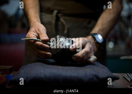 Buenos Aires, Argentina. 19th Apr, 2017. Craftsman Ramon Vidal holds a mate tea set in his workshop in Buenos Aires, Argentina, on April 19, 2017. Mate tea is a type of herbal tea which is very popular in Argentina. Credit: Martin Zabala/Xinhua/Alamy Live News Stock Photo