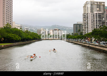 Kayak racing on Ala Wai Canal, north Waikiki, Hawaii Stock Photo