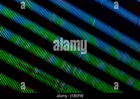 Real abstract graphic colored background of illumination in green and blue halftones colors geometric pattern. Modern pattern, wallpaper or banner design. Stock Photo