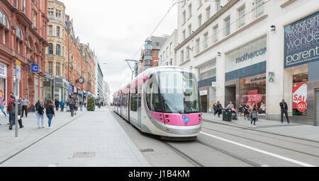 Electric trams on Corporation Street in Birmingham City Centre Stock Photo