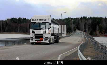 SALO, FINLAND - APRIL 14, 2017: White Next Generation Scania R500 semi tanker for ADR haul of Cemt-Trans moves along bridge over sea in South of Finla Stock Photo