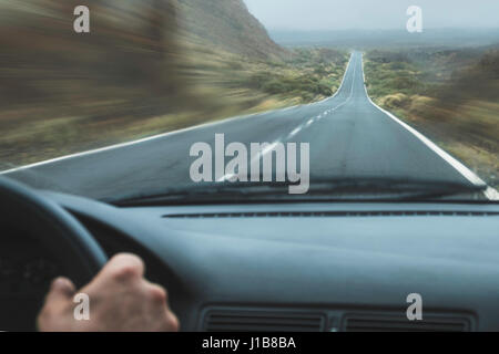 driving car on highway in landscape - pov Stock Photo