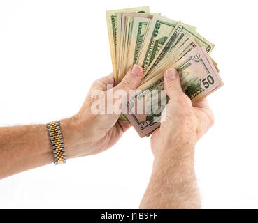 Holding a fan of money - fifty and twenty US dollar bills bank notes Stock Photo