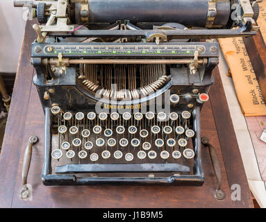 Old typewriter on a wooden table Stock Photo
