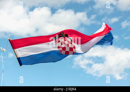 Croatian flag in the wind, Pag island, Croatia Stock Photo
