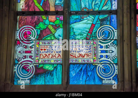 The new stained glass window, designed by Mucha, was installed in the north nave in 1931. Stock Photo