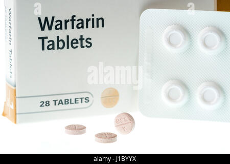 Warfarin tablets used to treat or prevent blood clots in veins or arteries, which can reduce the risk of strokes or heart attacks. Stock Photo