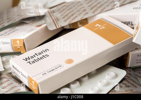 Warfarin tablets used to treat or prevent blood clots in veins or arteries, which can reduce the risk of strokes or heart attacks. Stock Photo