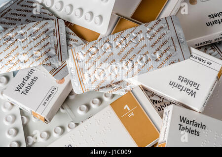 Warfarin tablets used to treat or prevent blood clots in veins or arteries, which can reduce the risk of strokes or heart attacks. Stock Photo