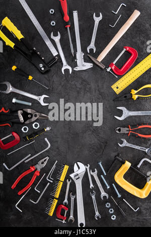 Top view of set of construction tools on black background Stock Photo