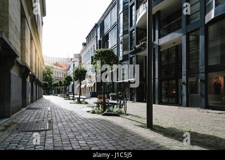 Antwerp, Belgium - July 28, 2016:  Pedestrian street in Antwerp at sunset with sunlight on background. It is a city in Belgium in the region of Flande Stock Photo