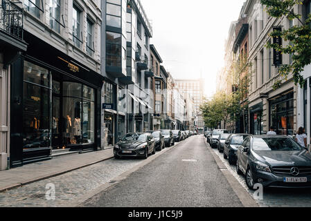 Antwerp, Belgium - July 28, 2016:  Commercial street in Antwerp at sunset with sunlight on background. It is a city in Belgium in the region of Flande Stock Photo