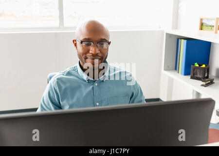 African American man using computer in office Stock Photo